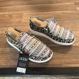 Hey Dude Black and White Flats with Slip-On Design